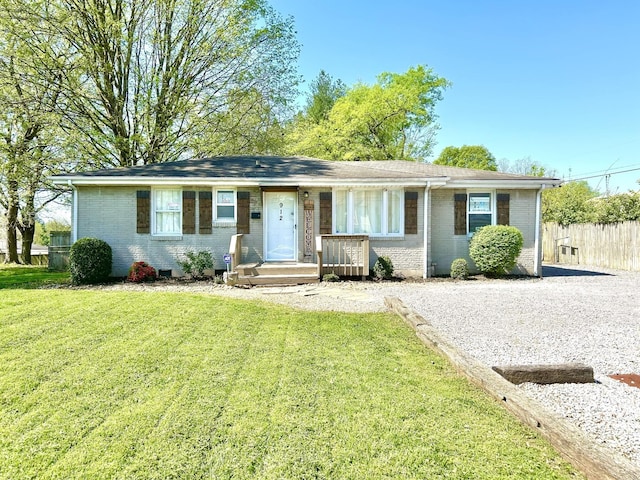 single story home with a front lawn