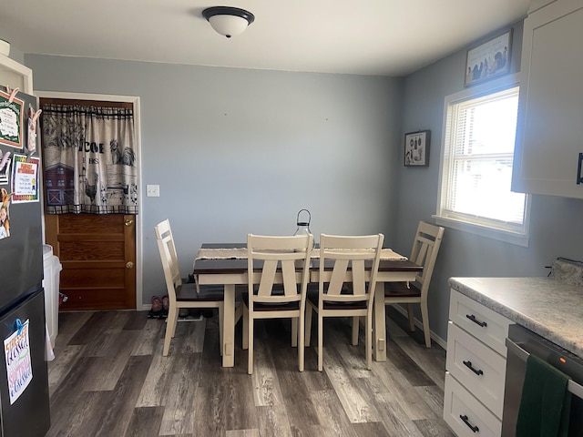 dining space featuring dark hardwood / wood-style flooring