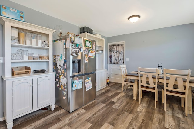 dining area featuring dark wood-style floors