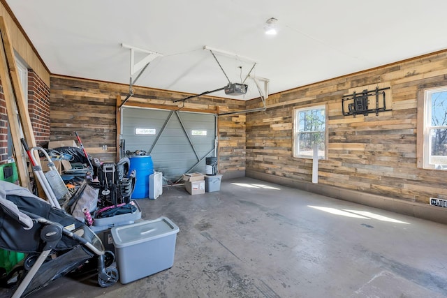 garage with wooden walls and a garage door opener