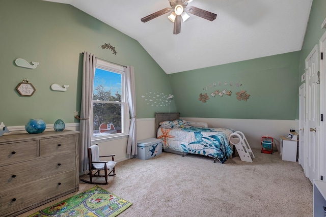 bedroom featuring ceiling fan, light carpet, and vaulted ceiling