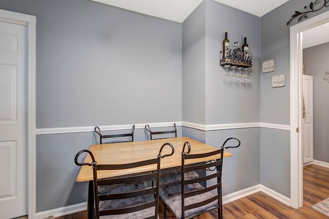 dining area with hardwood / wood-style flooring