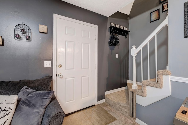 entryway with carpet floors