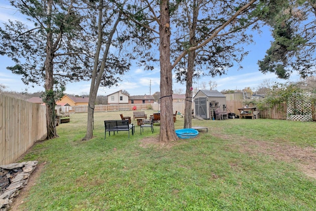 view of yard with a storage shed