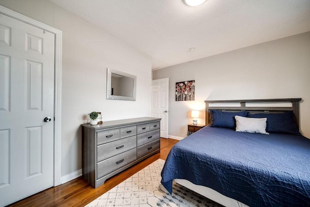 bedroom featuring dark hardwood / wood-style flooring