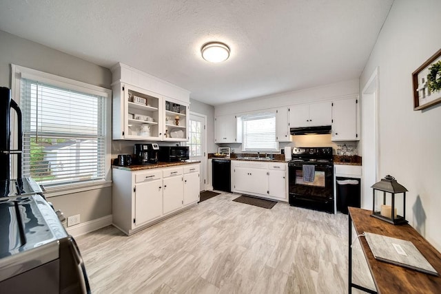 kitchen featuring black appliances, sink, a textured ceiling, light hardwood / wood-style floors, and white cabinetry