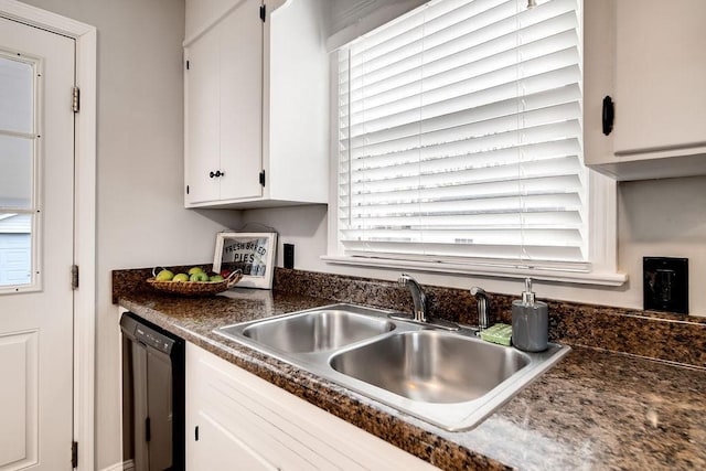 kitchen with sink, white cabinets, plenty of natural light, and black dishwasher