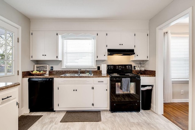 kitchen featuring black appliances, white cabinetry, sink, and light hardwood / wood-style flooring