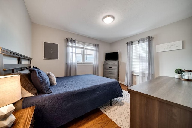 bedroom featuring hardwood / wood-style floors