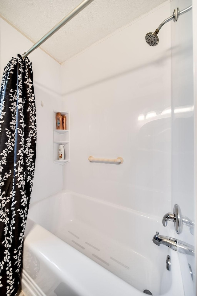 bathroom with shower / bath combo