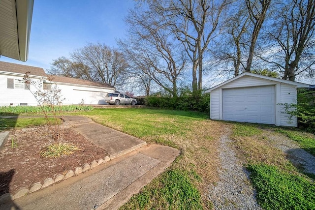 view of yard with an outbuilding and a garage