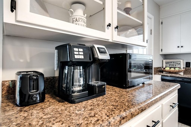 kitchen with white cabinets and black dishwasher