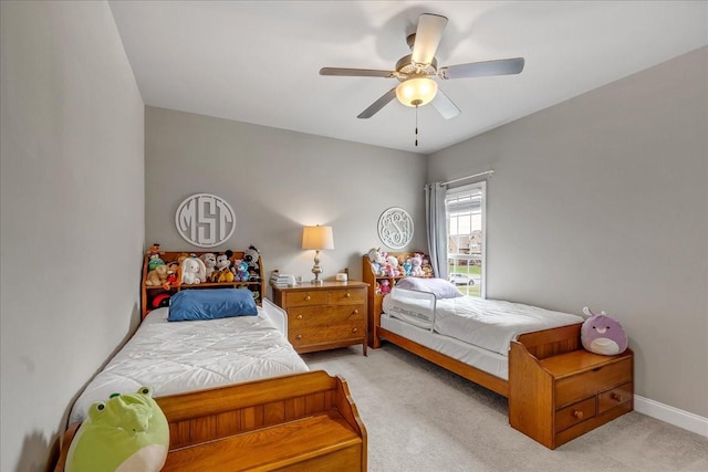 bedroom with ceiling fan and light colored carpet