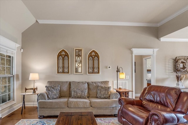 living room with hardwood / wood-style floors and ornamental molding