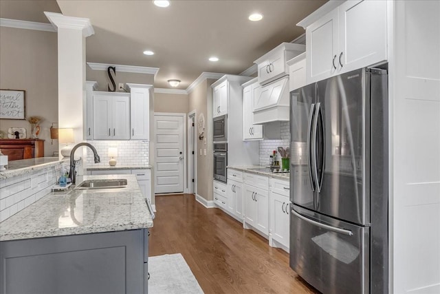 kitchen featuring sink, decorative backsplash, dark hardwood / wood-style floors, white cabinetry, and stainless steel appliances