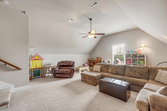 carpeted living room with ceiling fan and vaulted ceiling