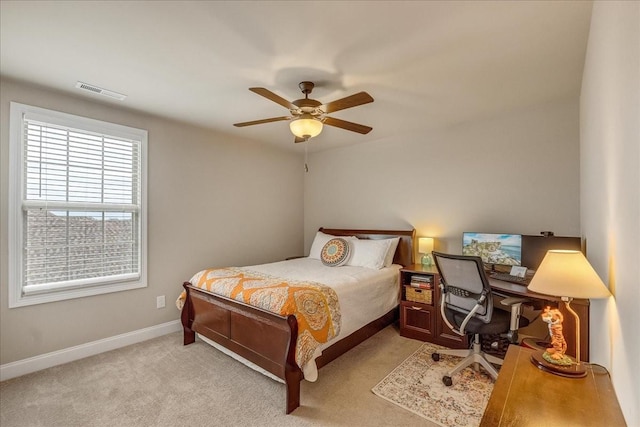 bedroom featuring ceiling fan and light carpet