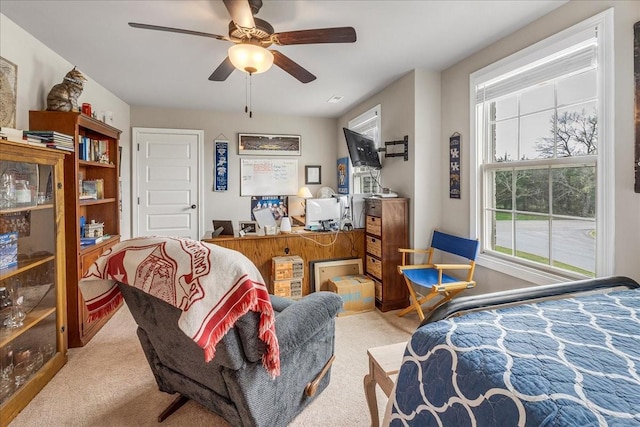 carpeted bedroom featuring ceiling fan