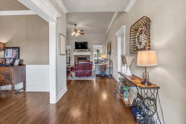 hallway featuring crown molding and dark hardwood / wood-style floors