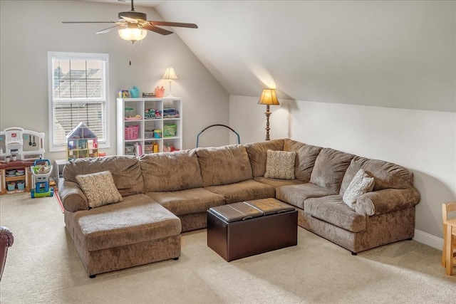 carpeted living room with ceiling fan and lofted ceiling