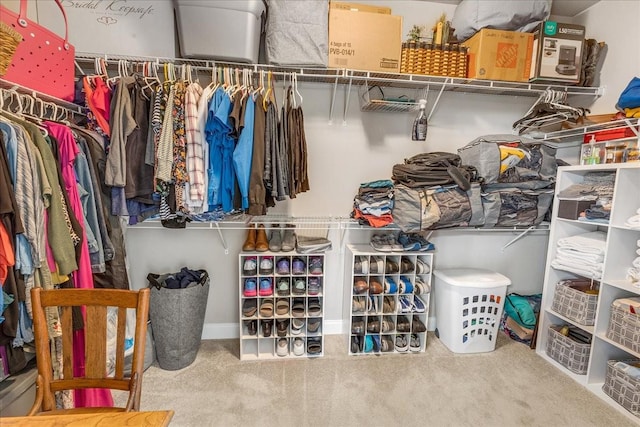 walk in closet featuring carpet