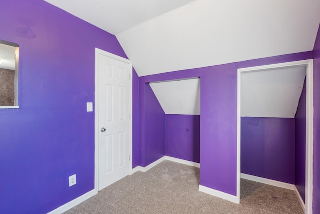 additional living space with lofted ceiling and carpet floors