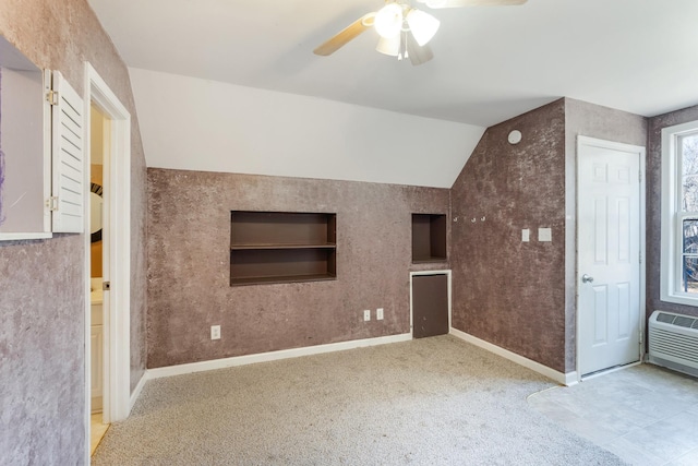 unfurnished living room with ceiling fan, light colored carpet, and vaulted ceiling