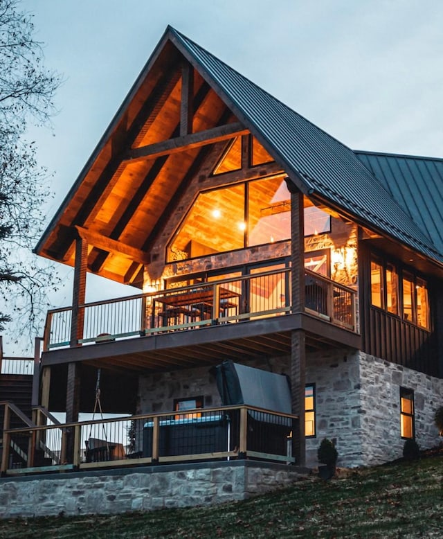 rear view of house featuring a balcony