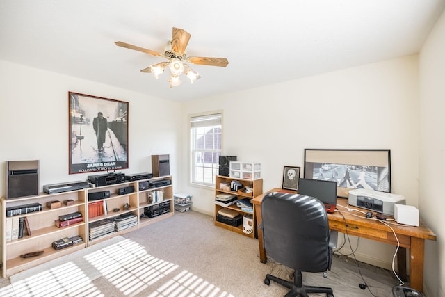 home office featuring carpet flooring and ceiling fan