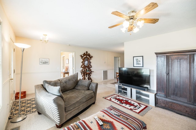 carpeted living room featuring ceiling fan