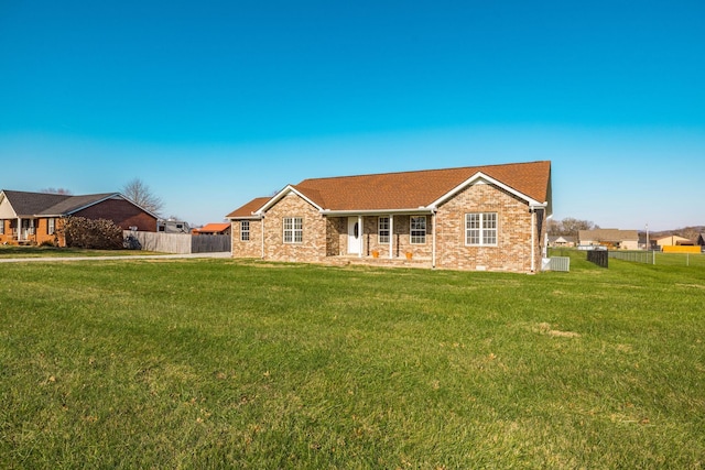 ranch-style house with a front yard and central AC