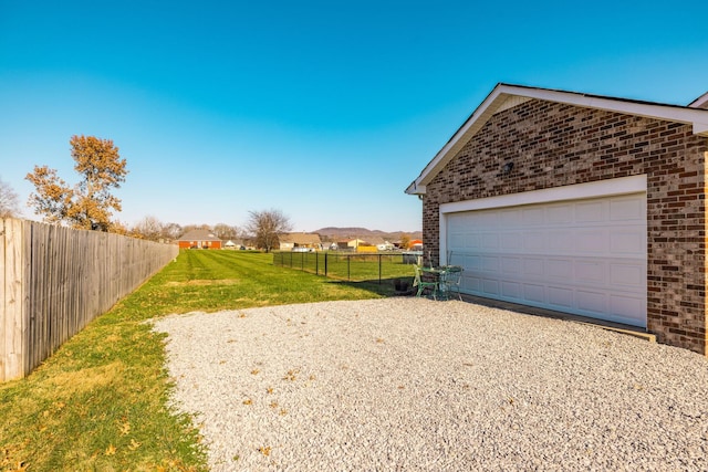 garage featuring a yard