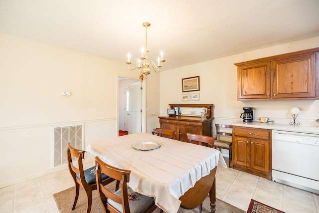 dining space with a notable chandelier