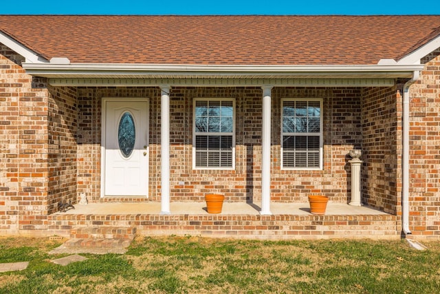 view of exterior entry featuring a porch