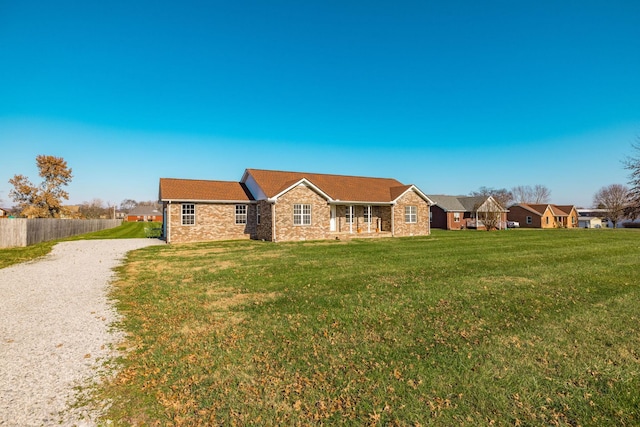 single story home featuring a front yard