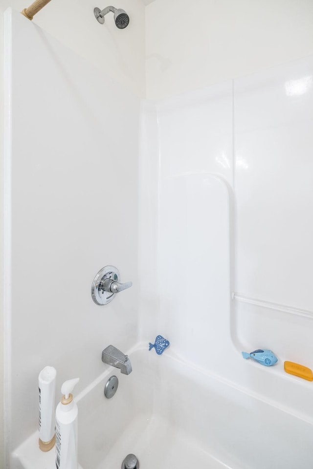 bathroom with shower / tub combination