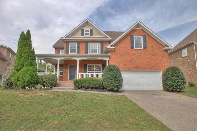 view of front of home featuring a garage, covered porch, and a front lawn