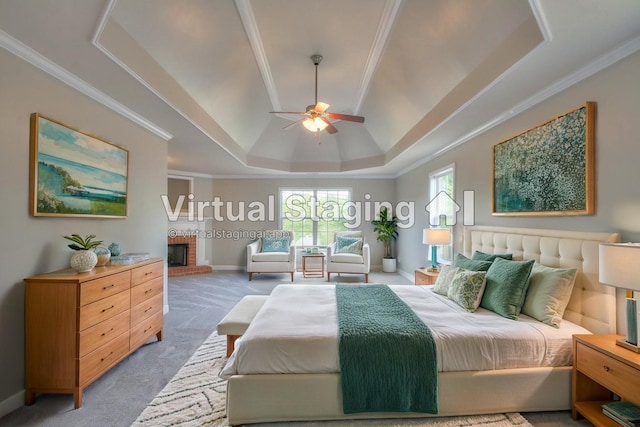 bedroom featuring ceiling fan, a brick fireplace, a raised ceiling, crown molding, and carpet floors