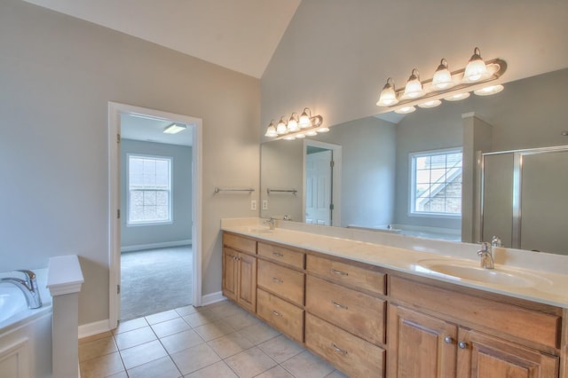 bathroom with vanity, tile patterned floors, plenty of natural light, and independent shower and bath