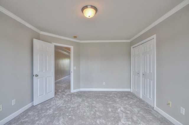 unfurnished bedroom with light colored carpet, a closet, and ornamental molding