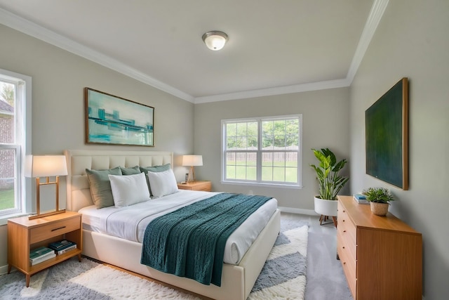 bedroom featuring multiple windows and crown molding