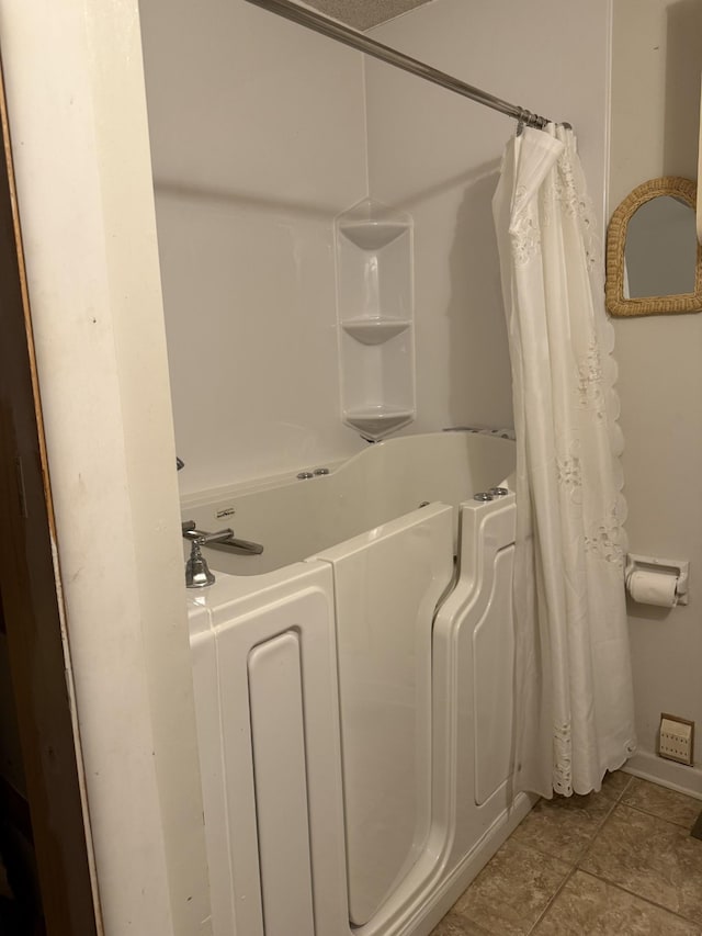 bathroom with tile patterned flooring