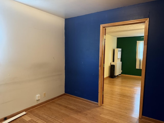 unfurnished room featuring hardwood / wood-style floors