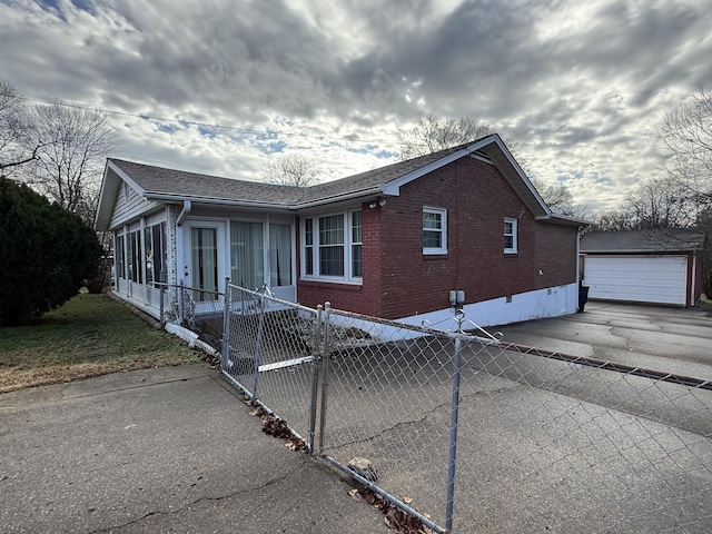 view of property exterior featuring a garage and an outdoor structure