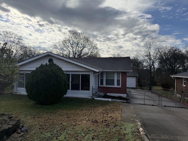 ranch-style house with a front lawn