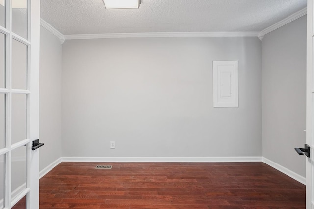 unfurnished room with ornamental molding, a textured ceiling, and dark wood-type flooring