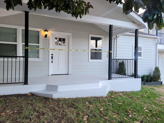 doorway to property with a porch