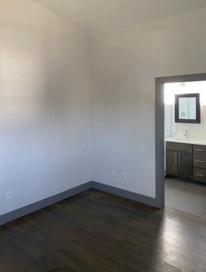 empty room with dark wood-type flooring