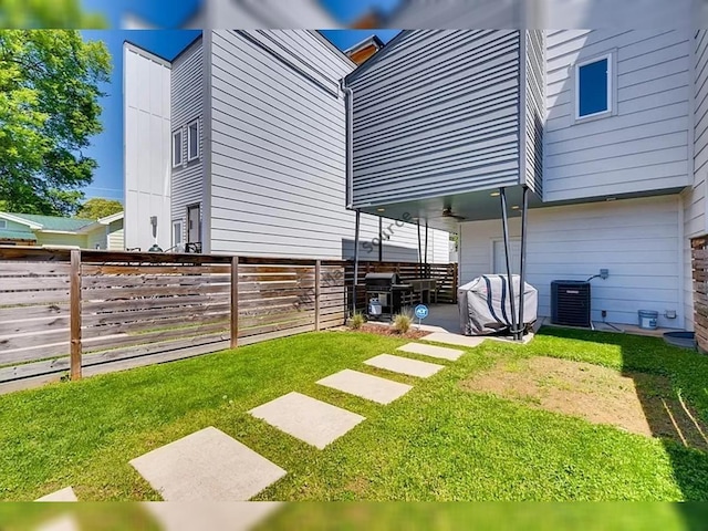 view of yard with a patio area and central AC