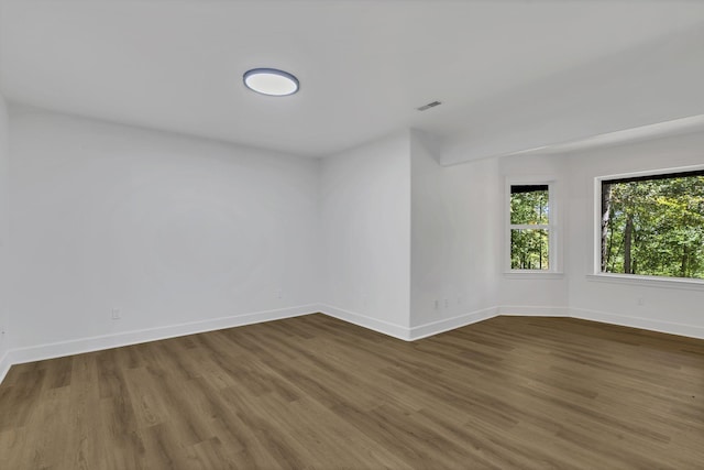 empty room featuring dark wood-type flooring